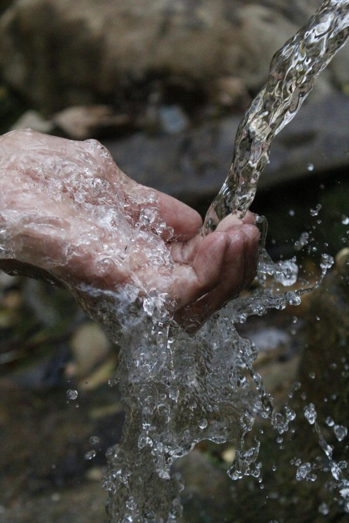 Hand and clean water
